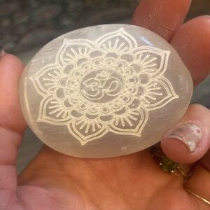 Om engraved selenite palmstone